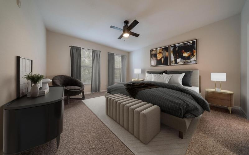 a bedroom with furniture and ceiling fan