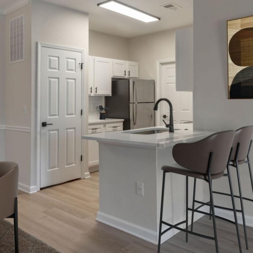 a kitchen with a table and chairs