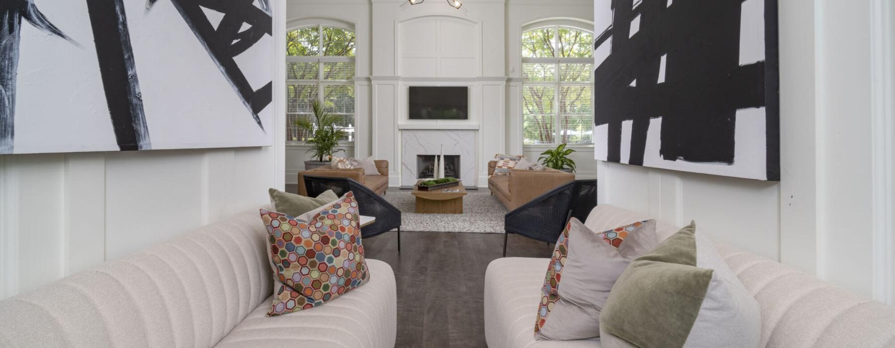 a lounge with a couches and a view of seating fireplace and tv